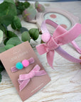 Headband with pompom balls and bow