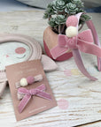 Headband with pompom balls and bow