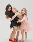 Set of skirt with balls and long sleeves in black