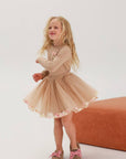 Beige skirt and long-sleeved top set with bow