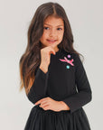 Set of skirt with balls and long sleeves in black