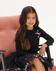 Set of skirt with balls and long sleeves in black